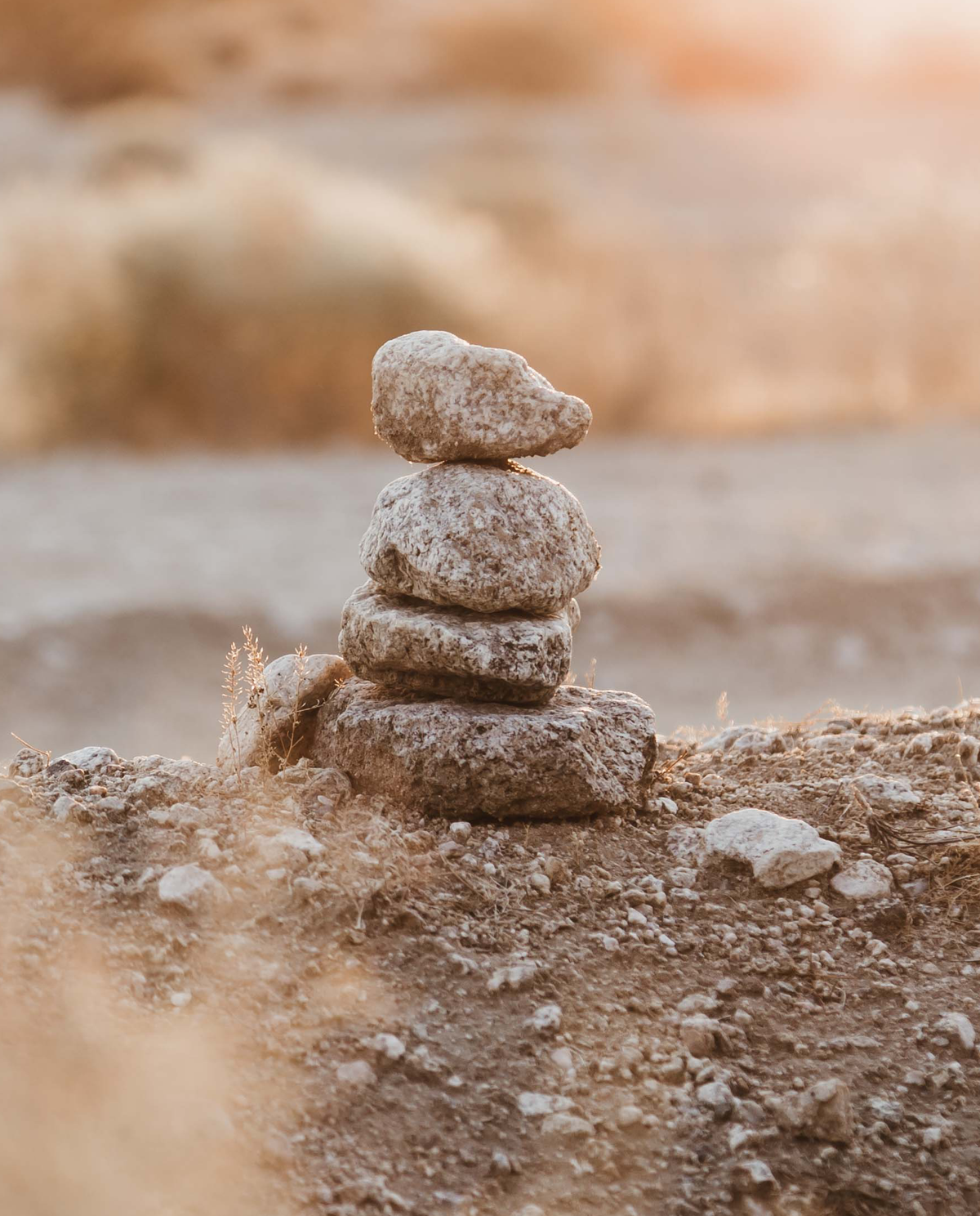 Artfully stacked rocks on the desert ground